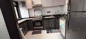 Kitchen in 2 BHK Apartment at Indradarshan II, Oshiwara – for Rent