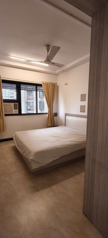 Bedroom in 2 BHK Apartment at Indradarshan II, Oshiwara – for Rent