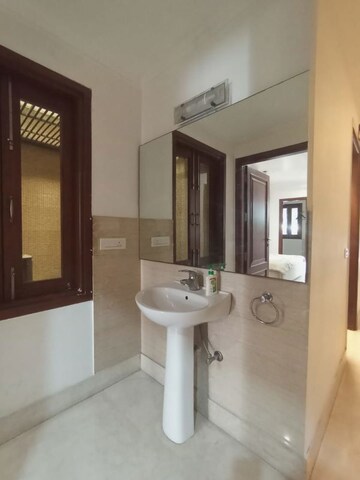 Bathroom in 3.5 BHK Apartment at Pamposh Enclave – for Rent