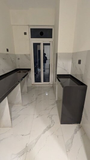 Kitchen in 2 BHK Apartment at Ruparel Sky Green, Kandivali West – for Sale