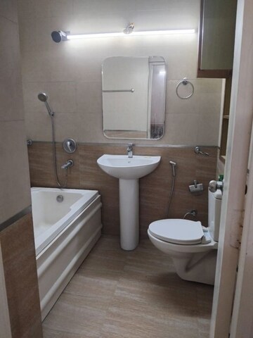 Bathroom in 3 BHK Apartment at Malibu Shopping Arcade, South City 2 – for Rent