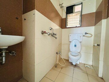 Bathroom in 2 BHK Apartment at Paranjape Madhukosh Phase III, Dhayari – for Rent