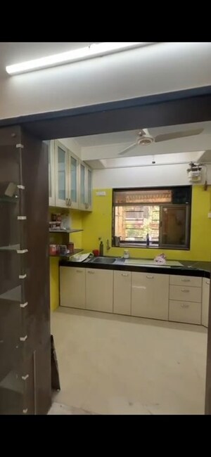 Kitchen in 2 BHK Apartment at Ahimsa Niketan CHS, Malad West – for Rent