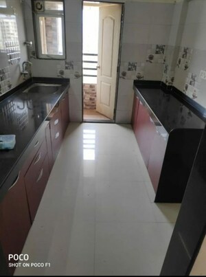 Kitchen in 2 BHK Apartment at Rosa Gardenia, Ghodbunder Road – for Rent