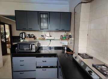 Kitchen in 3 BHK Apartment at Pearl Prabha Apartment, Andheri West – for Sale