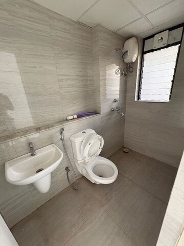 Bathroom in 1 BHK Apartment at Runwal Gardens Phase I, Dombivli East – for Rent