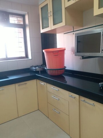 Kitchen in 1 BHK Apartment at Om Vaikunt Apartments, Chembur – for Sale