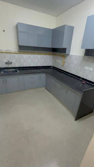 Kitchen in 2 BHK Apartment at Shri Radha Sky Gardens, Sector 16b Greater Noida – for Rent