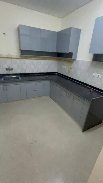 Kitchen in 2 BHK Apartment at Shri Radha Sky Gardens, Sector 16b Greater Noida – for Rent