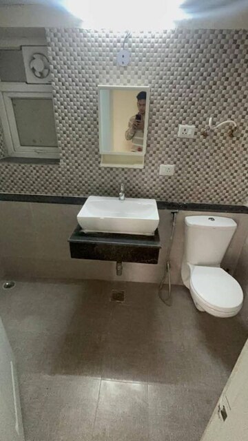 Bathroom in 2 BHK Apartment at Shri Radha Sky Gardens, Sector 16b Greater Noida – for Rent