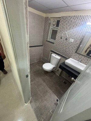Bathroom in 3 BHK Apartment at Shri Radha Sky Gardens, Sector 16b Greater Noida – for Rent