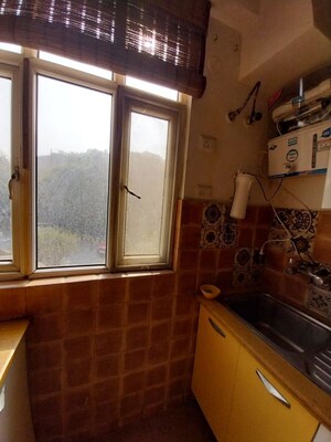 Kitchen in 2 BHK Apartment at Vasundhara Sector 11 – for Sale