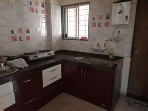 Kitchen in 2 BHK Apartment at Nirman Nisarga, Bhusari Colony – for Rent