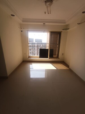 Living Room in 1 BHK Apartment at Agarwal Trinity Towers, Malad West – for Rent