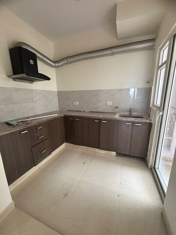 Kitchen in 2 BHK Apartment at Paramount Emotions, Sector 1 Greater Noida – for Rent