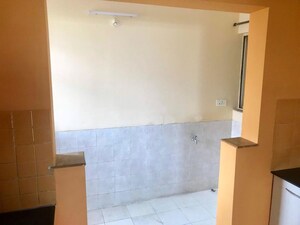 Room in 2 BHK Apartment at Rhythm Society, Wakad – for Rent