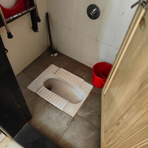Bathroom in 1 BHK Apartment at Indraprasth CHS, Anand Nagar – for Rent