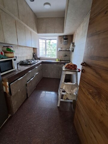 Kitchen in 3 BHK Apartment at Sarkar Avenue Apartment, Santacruz West – for Sale