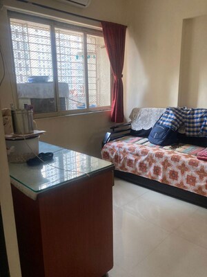 Living Room in 1 BHK Apartment at Shanti Gardens , Mira Road – for Sale