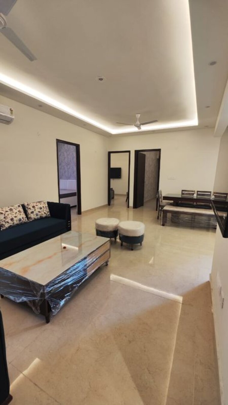 Living Room, maya-green-lotus-saksham 3 Bedroom 1346 Sq.Ft. Apartment In International Airport Road Zirakpur 9400537