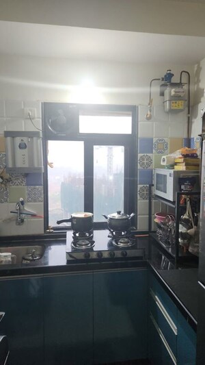 Kitchen in 1 BHK Apartment at Raunak Delight, Owale – for Rent