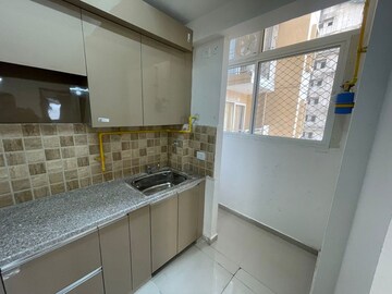 Kitchen in 2 BHK Apartment at Amrapali Golf Homes, Sector 4 Greater Noida – for Rent