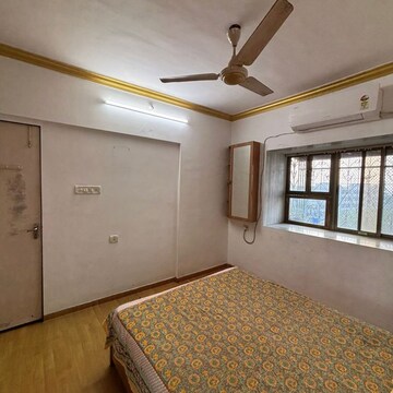 Bedroom in 2 BHK Apartment at Vaibhav CHS Andheri West, Sv Patel Nagar – for Rent