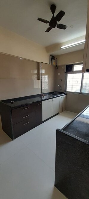 Kitchen in 3 BHK Apartment at Raj Sundaresh CHS, Goregaon West – for Sale