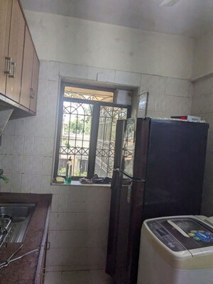 Kitchen in 1 BHK Apartment at Varsha CHS, Andheri West – for Sale