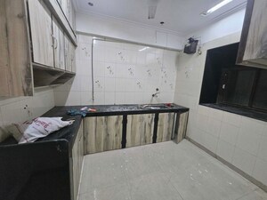 Kitchen in 2 BHK Apartment at Andheri CHS, Andheri West – for Rent