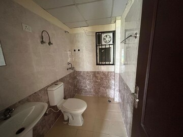 Bathroom in 2 BHK Apartment at Gardenia Golf City, Sector 75 – for Sale
