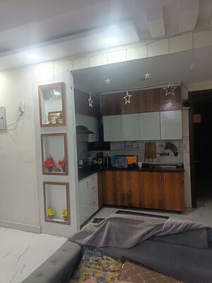 Kitchen in 2 BHK Apartment at Amrapali Eden Park, Sector 50 – for Sale