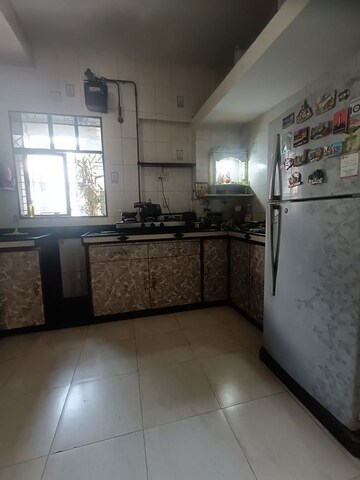 Kitchen in 2 BHK Apartment at Brindaban Mathura CHS, Vrindavan Society – for Sale