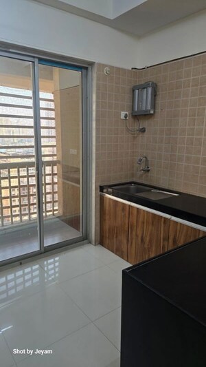 Kitchen in 2 BHK Apartment at Soham Tropical Lagoon, Ghodbunder Road – for Sale