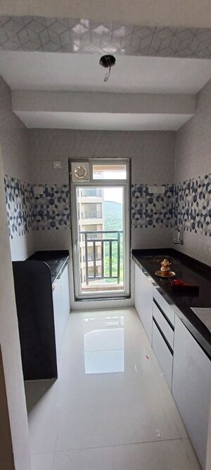 Kitchen in 1 BHK Apartment at Raunak Bliss, Ghodbunder Road – for Rent