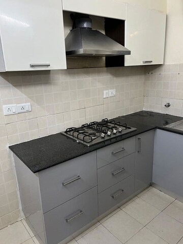 Kitchen in 3 BHK Builder Floor at Ansal API Esencia, Sector 67 – for Rent