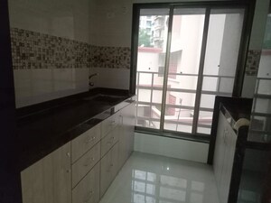 Kitchen in 2 BHK Apartment at Andheri CHS, Andheri West – for Rent