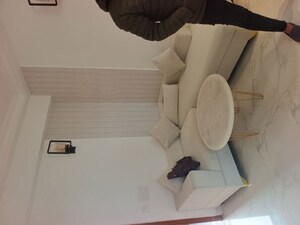 Living Room in Studio Apartment at Purvanchal Royal Square, Chi V Greater Noida – for Rent