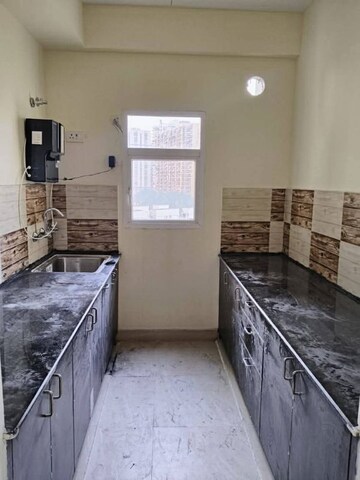 Kitchen in 2 BHK Apartment at BSB Vaibhav Heritage Height, Sector 16 Greater Noida – for Rent