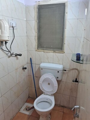 Bathroom in 2 BHK Apartment at New Jay Palace, Yari Road – for Rent