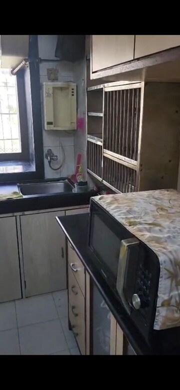 Kitchen in 2 BHK Apartment at Dheeraj Pooja, Malad West – for Rent