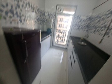 Kitchen in 1 BHK Apartment at Raunak Bliss B2, Ghodbunder Road – for Rent