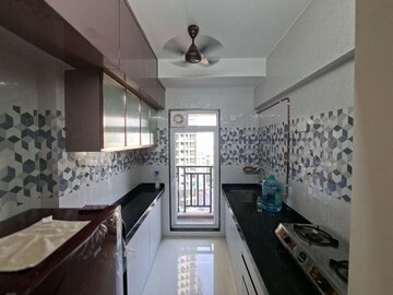 Kitchen in 1 BHK Apartment at Raunak Bliss B2, Ghodbunder Road – for Rent