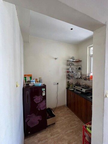 Kitchen in 1 RK Apartment at Urbtech Xaviers, Sector 168 – for Rent
