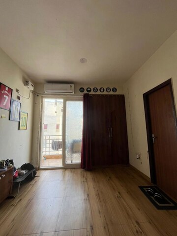 Living Room in 1 RK Apartment at Urbtech Xaviers, Sector 168 – for Rent