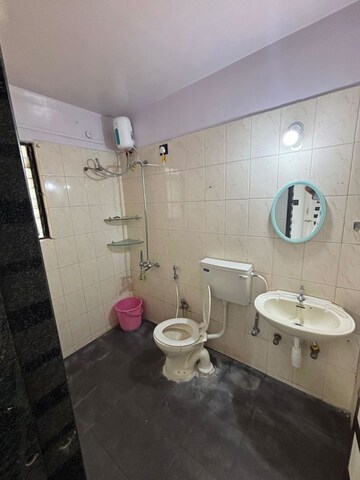 Bathroom in 2 BHK Apartment at Sai Sagar Apartment, Kalwa – for Sale