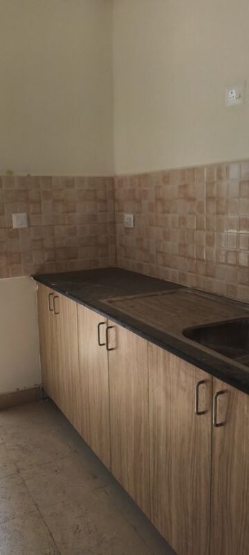 Kitchen in 3.5 BHK Apartment at Amrapali Crystal Homes, Sector 76 – for Rent