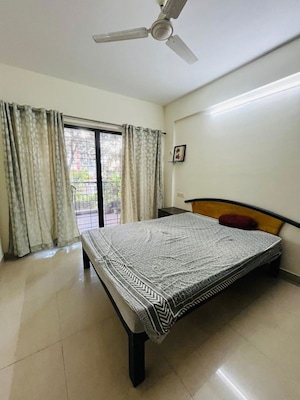 Bedroom in 2 BHK Apartment at Brahma Suncity, Wadgaon Sheri – for Rent