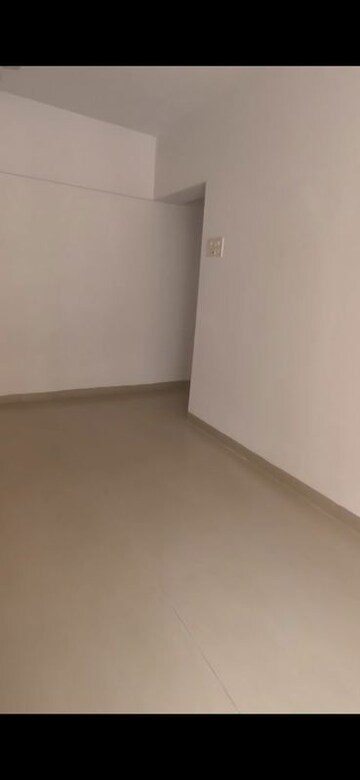 Living Room in 2 BHK Apartment at K Raheja Palm Court, Malad West – for Rent