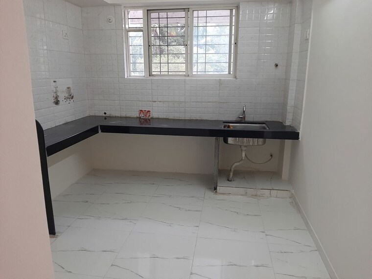 Kitchen, laxmi-ganga-heights 2 Bedroom 950 Sq.Ft. Apartment In Anand Nagar Pune 9772456